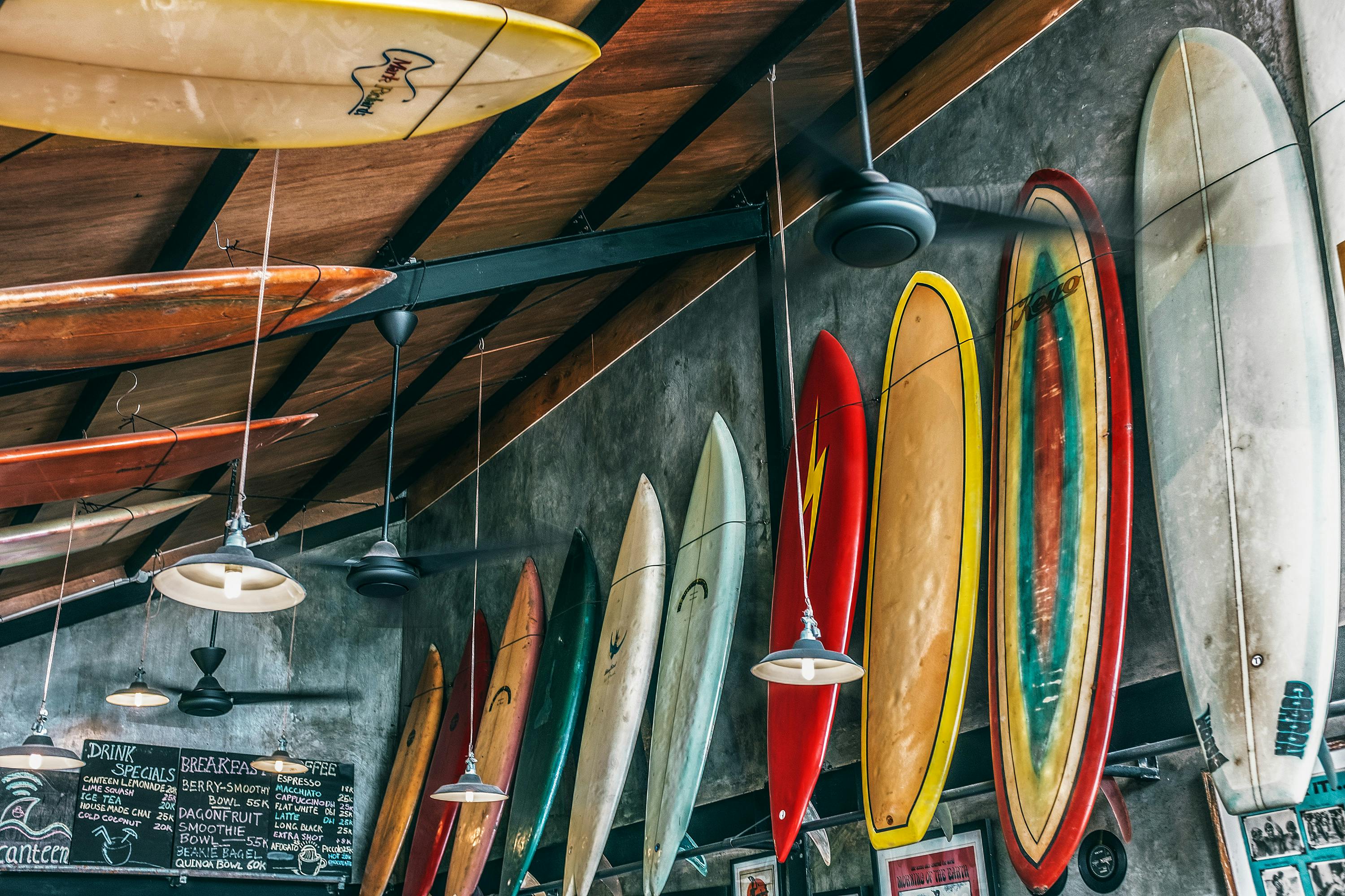 Collection of aged surfboards on wall and ceiling · Free Collection of aged surfboards on wall and ceiling · Free