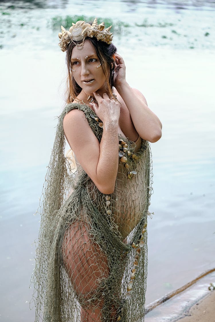 Elegant Pregnant Lady Standing On Lake Shore In Character Costume