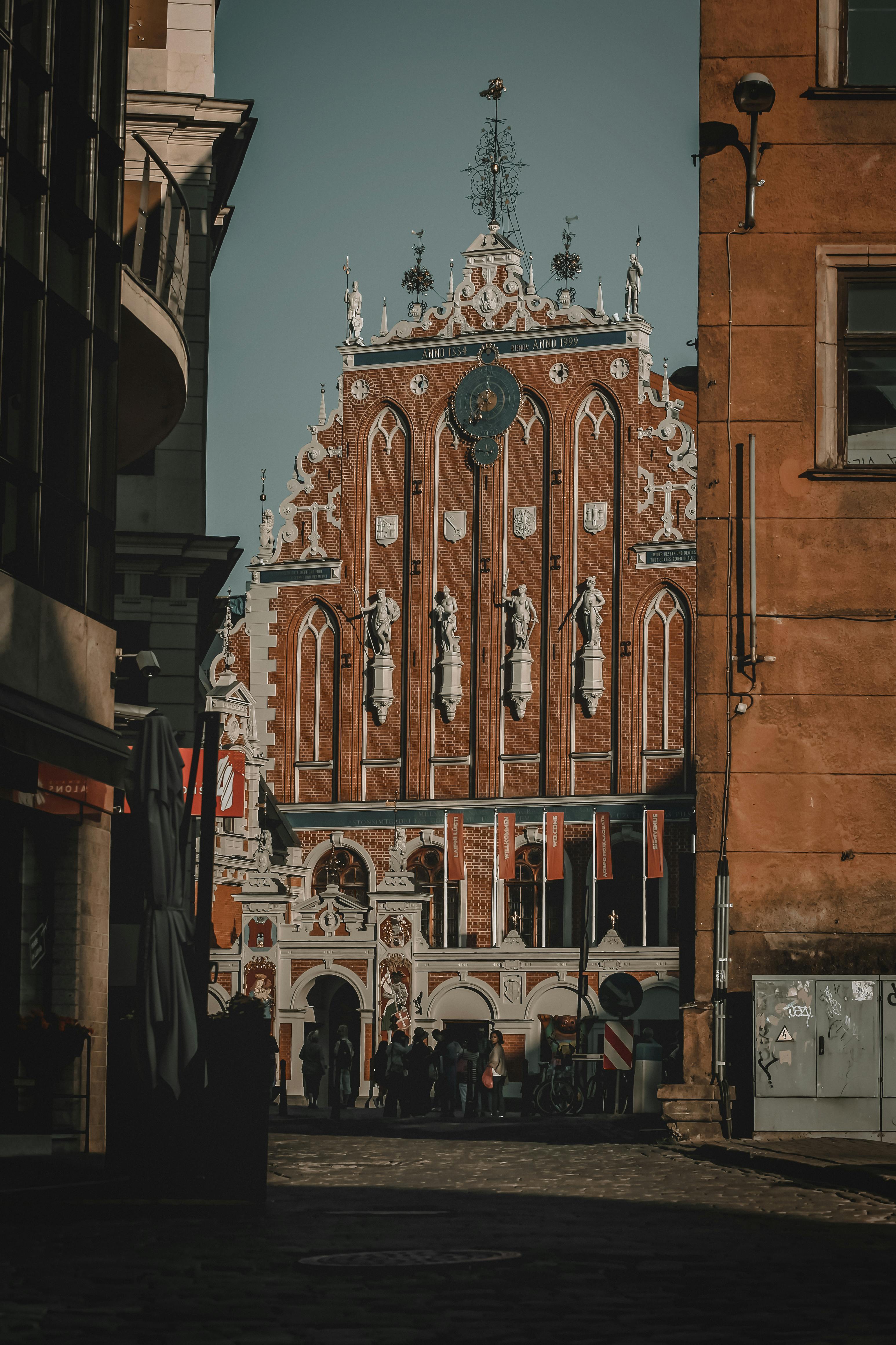 facade of medieval brick house of blackheads palace