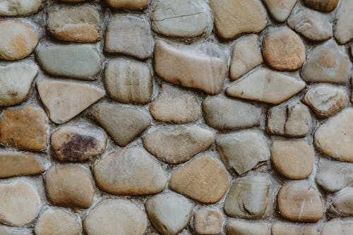 Rough wall texture with smooth stones
