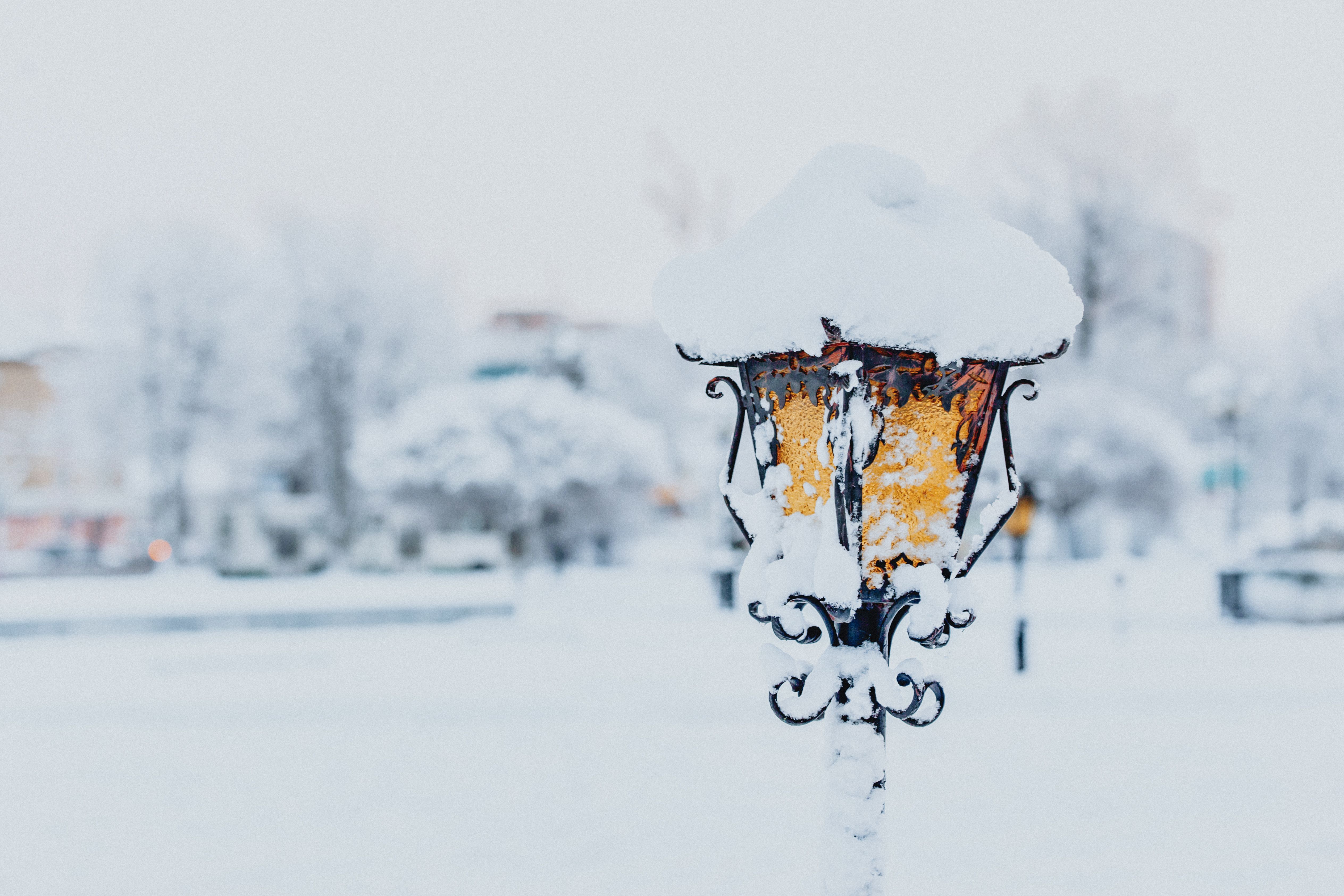 Lantern located on city street covered with snow · Free Stock Photo