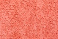 Coral stucco background of bright wall