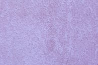 Abstract background of purple colored stucco surface
