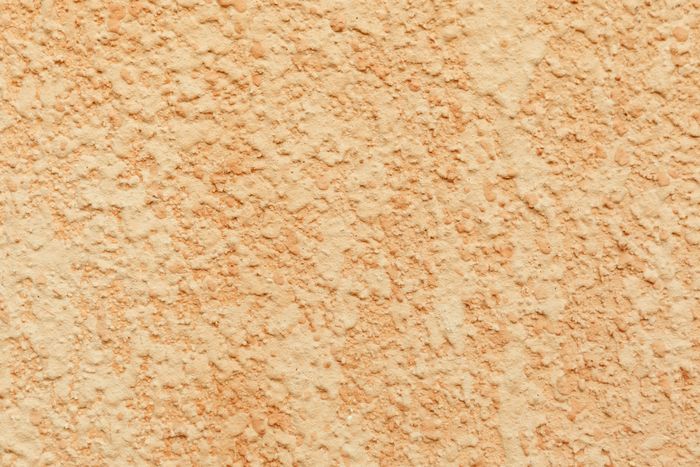 Finished stucco exterior on a multi-family building