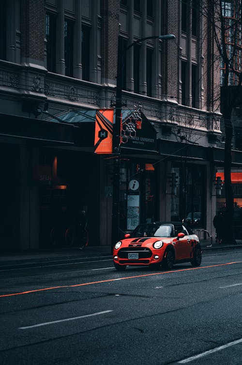 Modern car moving along empty roadway