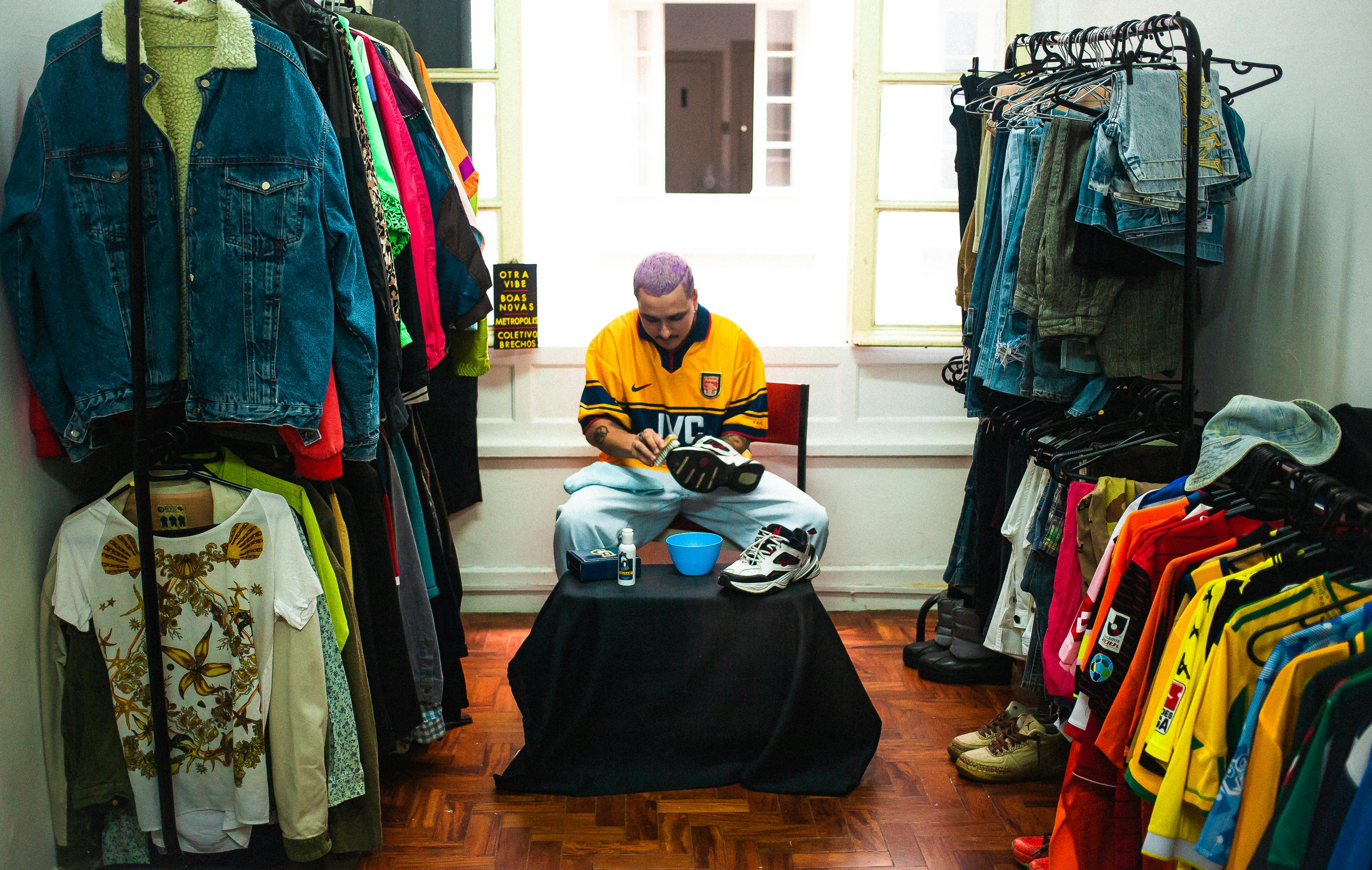 Retail store setup with organized displays and modern shelving, businessman inspecting merchandise