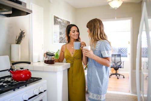 Free Women holding Ceramic Cups  Stock Photo