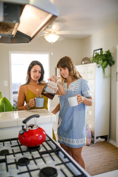 Free Women standing by the Kitchen Counter  Stock Photo