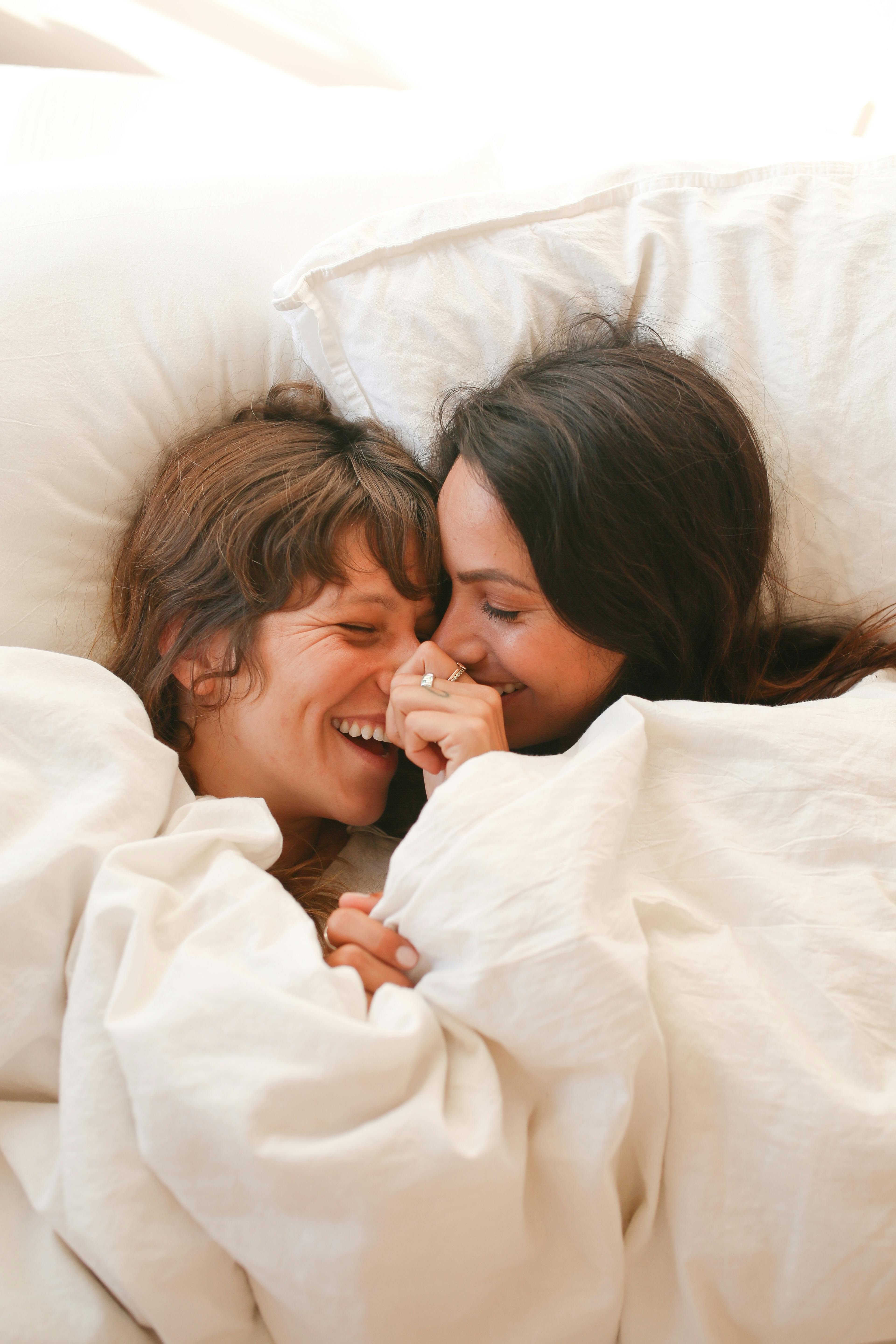 happy couple on bed