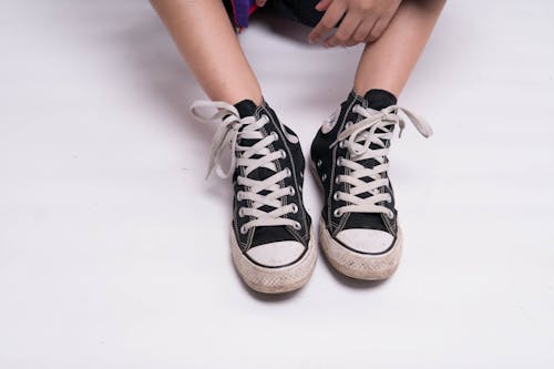 Free Crop person in trendy sneakers Stock Photo