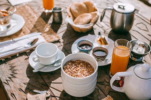 Served table with breakfast on street