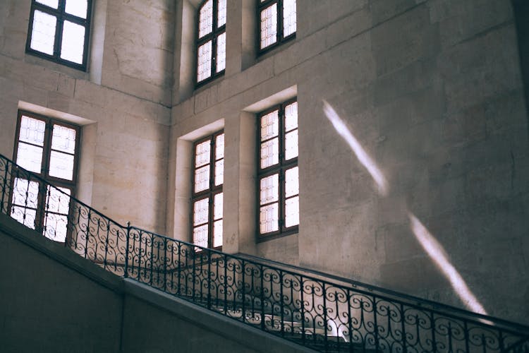 Stairs With Ornamental Balustrade In Old Stone Building