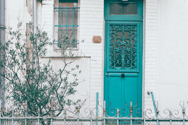 Ornamental Entrance Door Of Old House In City