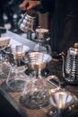 Crop barista preparing coffee using metal pot