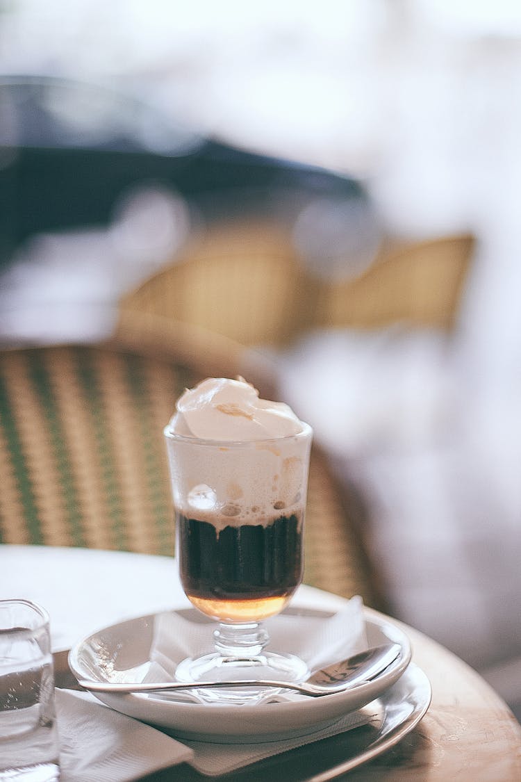 Delicious Irish Coffee In Transparent Mug In Restaurant