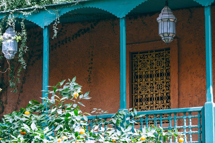 Old House Facade With Terrace Near Fruit Plant