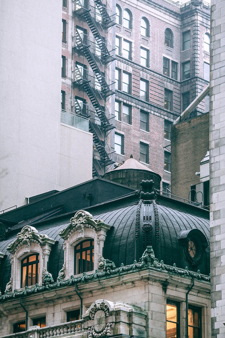 Old Building Facades With Stone Decor And Stairs In Town