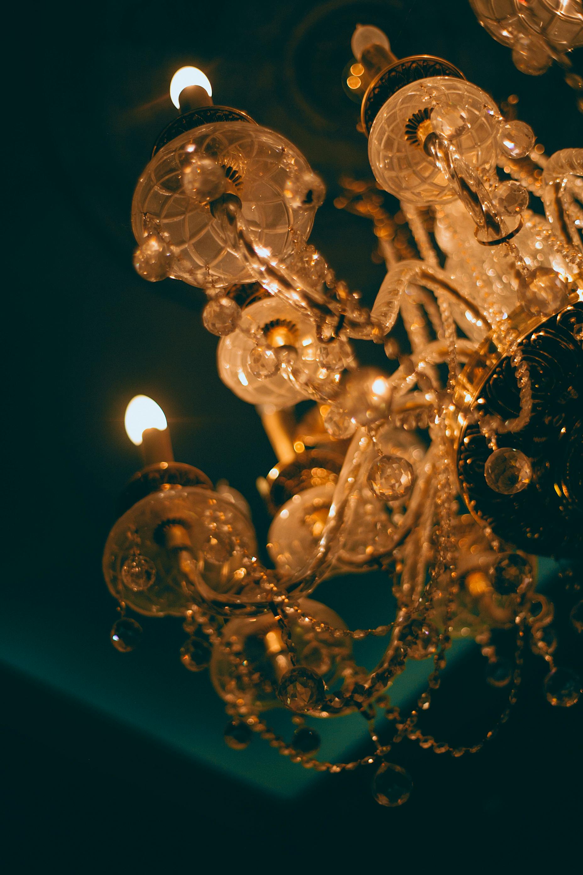 chandelier with ornament and shiny lights in darkness