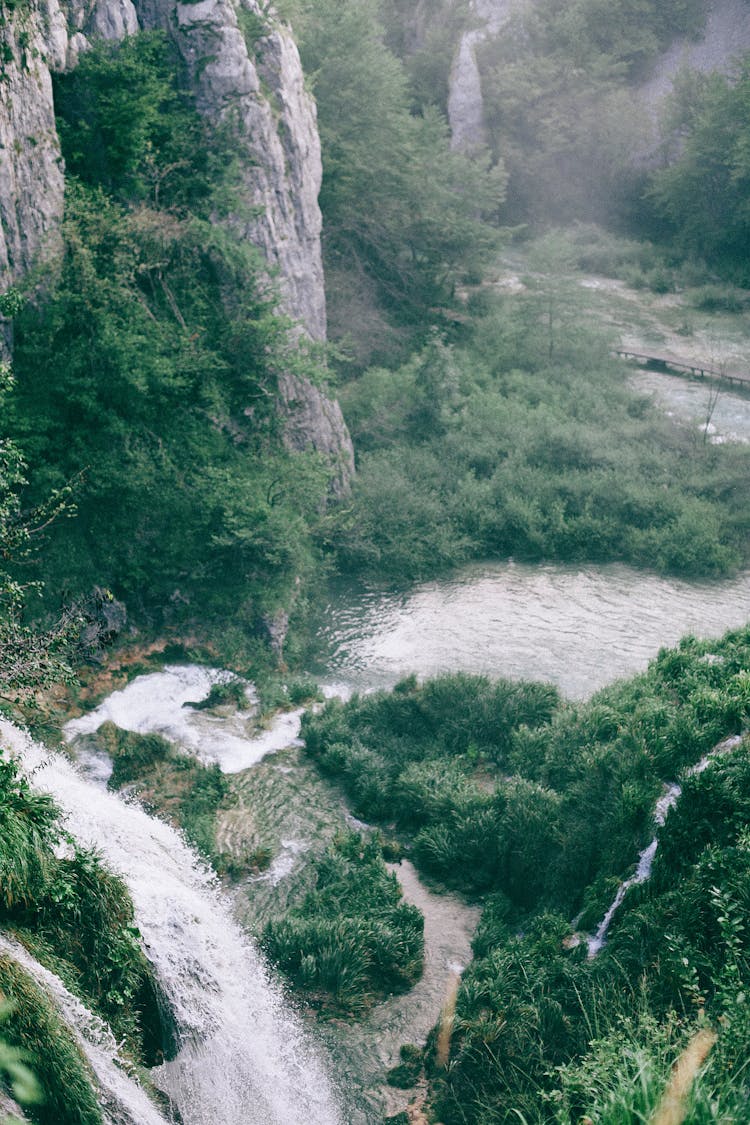 Rapid Waterfall On High Mount Near Pond