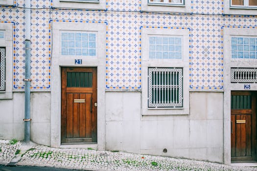 Facade of modern residential building with wooden doors and ornamental tiled walls in daylight