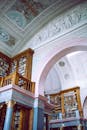Interior of old palace with bas relief walls and bookcases