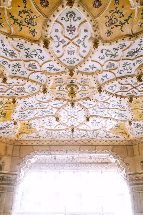 Ornamental ceiling in old masonry palace in sunshine