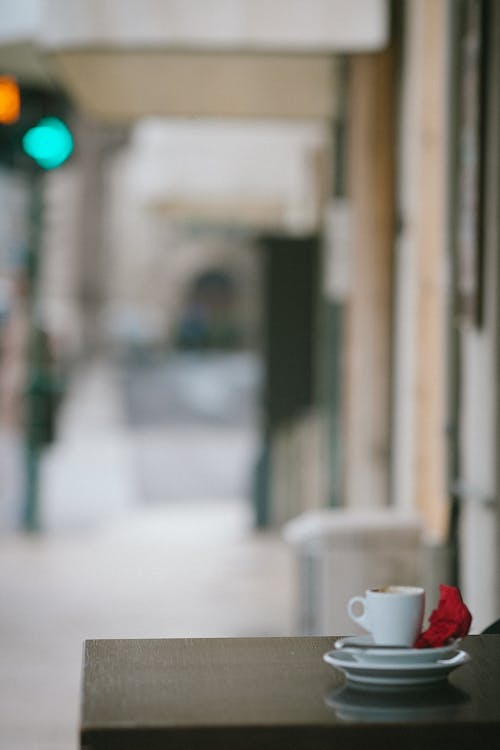 Free Dirty coffee cup on outdoor cafeteria table Stock Photo