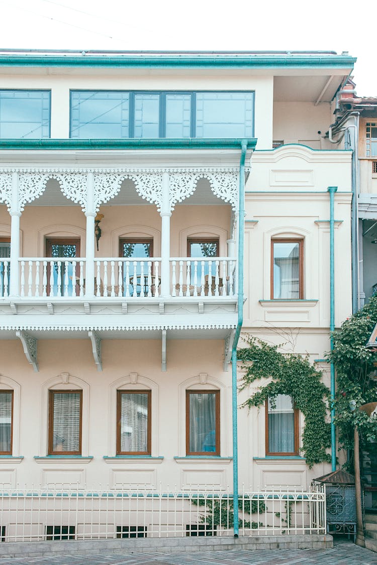 Facade Of Modern Residential Building With Ornamental Balcony