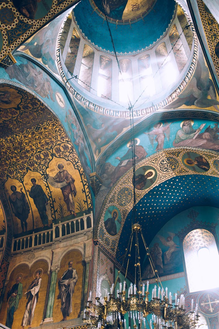 Ornamental Ceiling In Medieval Church With Chandelier And Fresco Paintings