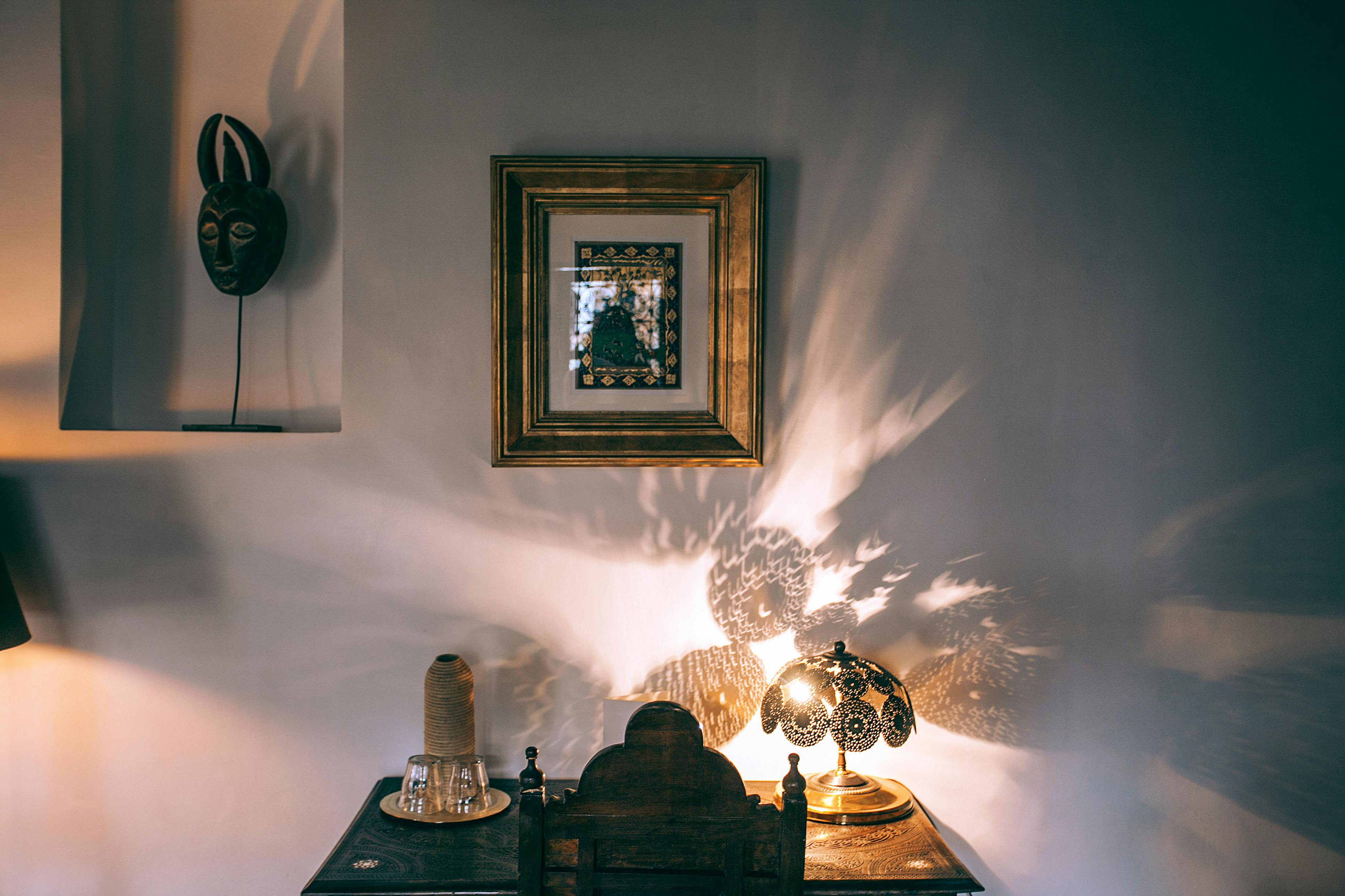 interior of dark room with oriental lamp on table