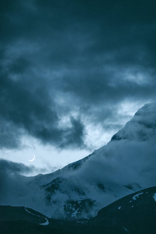 Moon Under Dark Cloudy Sky