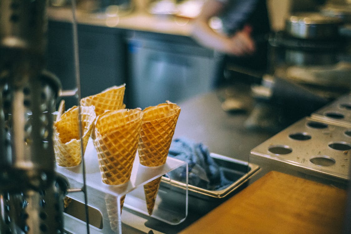 Crispy waffle horns for ice cream balls prepared for delicious dessert in cafe