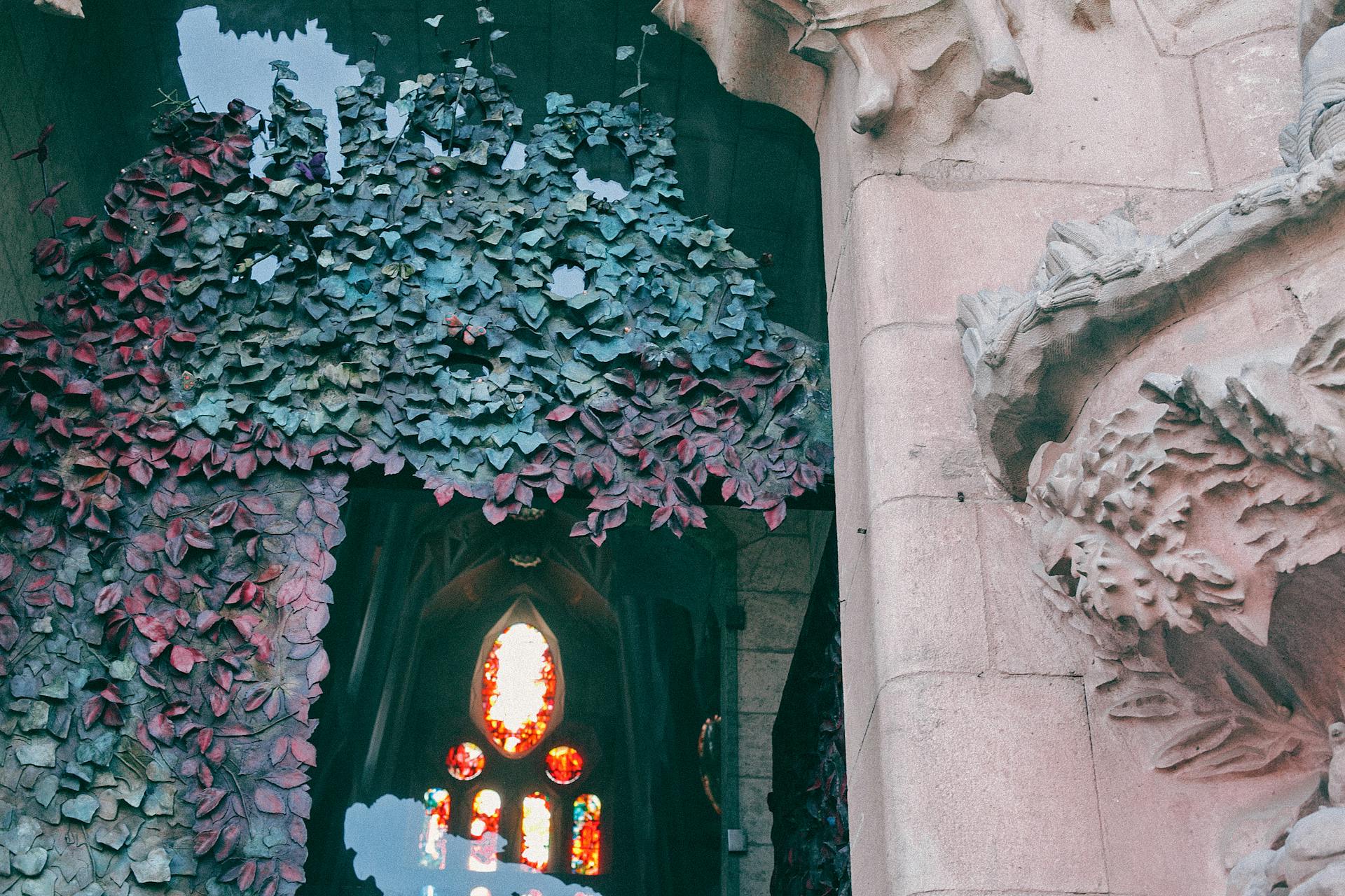 Part of ancient stone church wall decorated with ornamental relief elements and sculptures