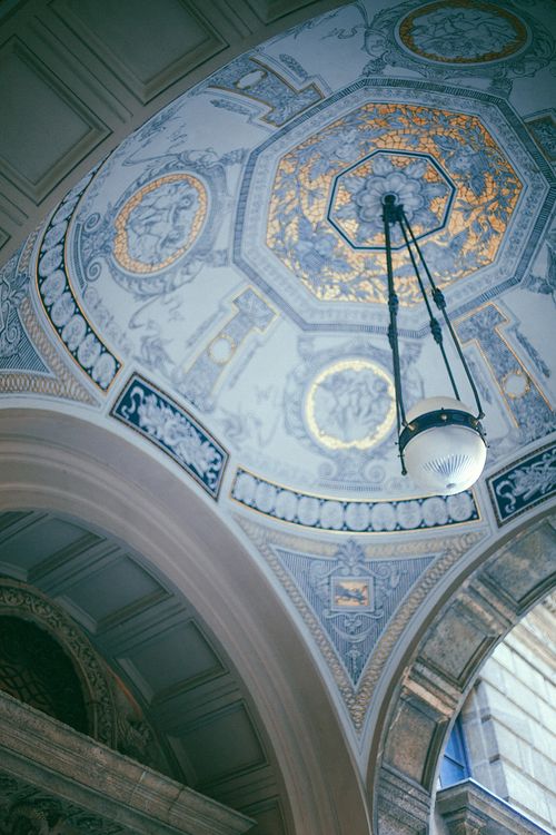 Free From below of ceiling decorated with ornamental patterns in old cathedral with arch doorways Stock Photo