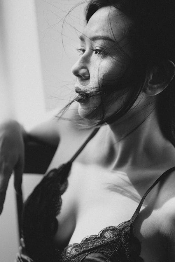 Asian woman in lingerie looking away