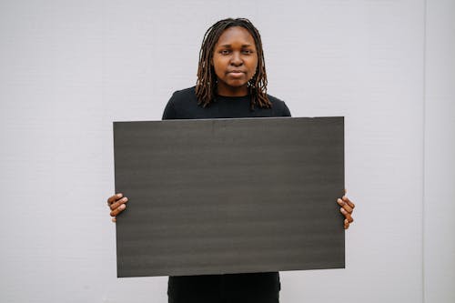 A Woman Holding a Blank Placard