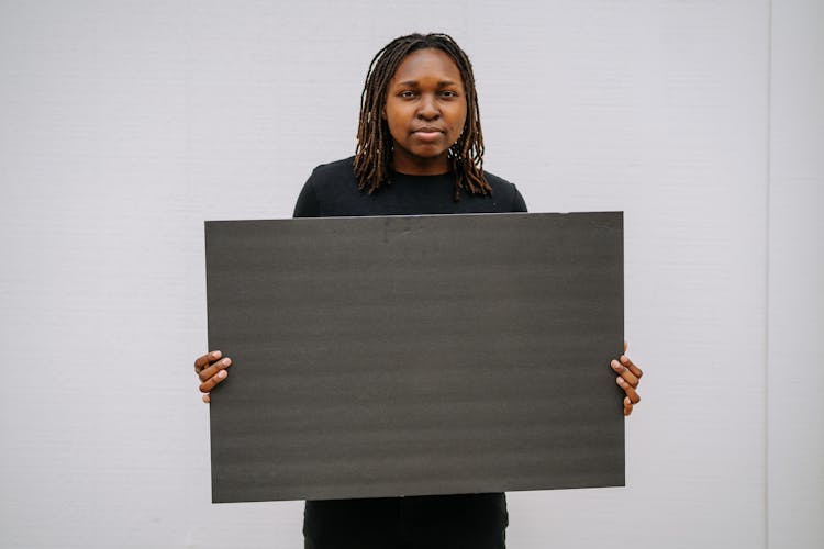 A Woman Holding A Blank Placard