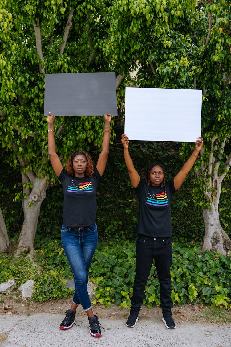 Women Holding Blank Placards In The Air