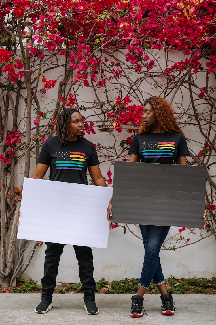 Women Holding Blank Placards