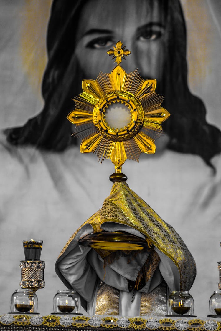 A Traditional Gold Monstrance With Gold Fabric 