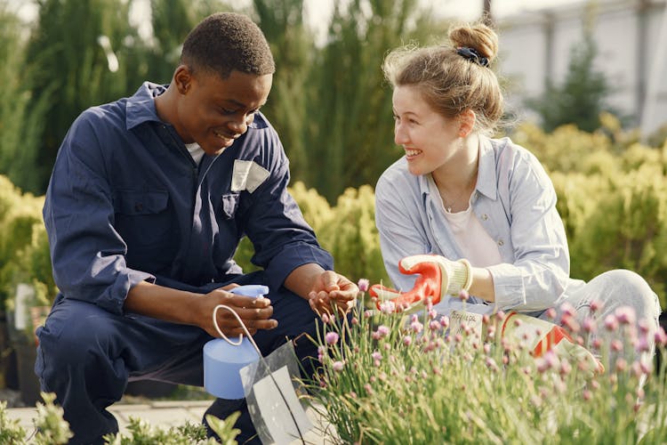 A Man And A Woman Gardening Together