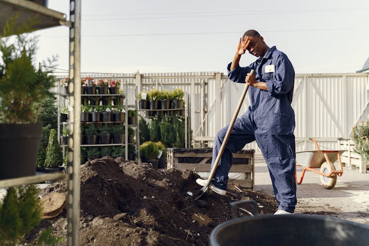 Construction Worker In Blue Jumpsuit 