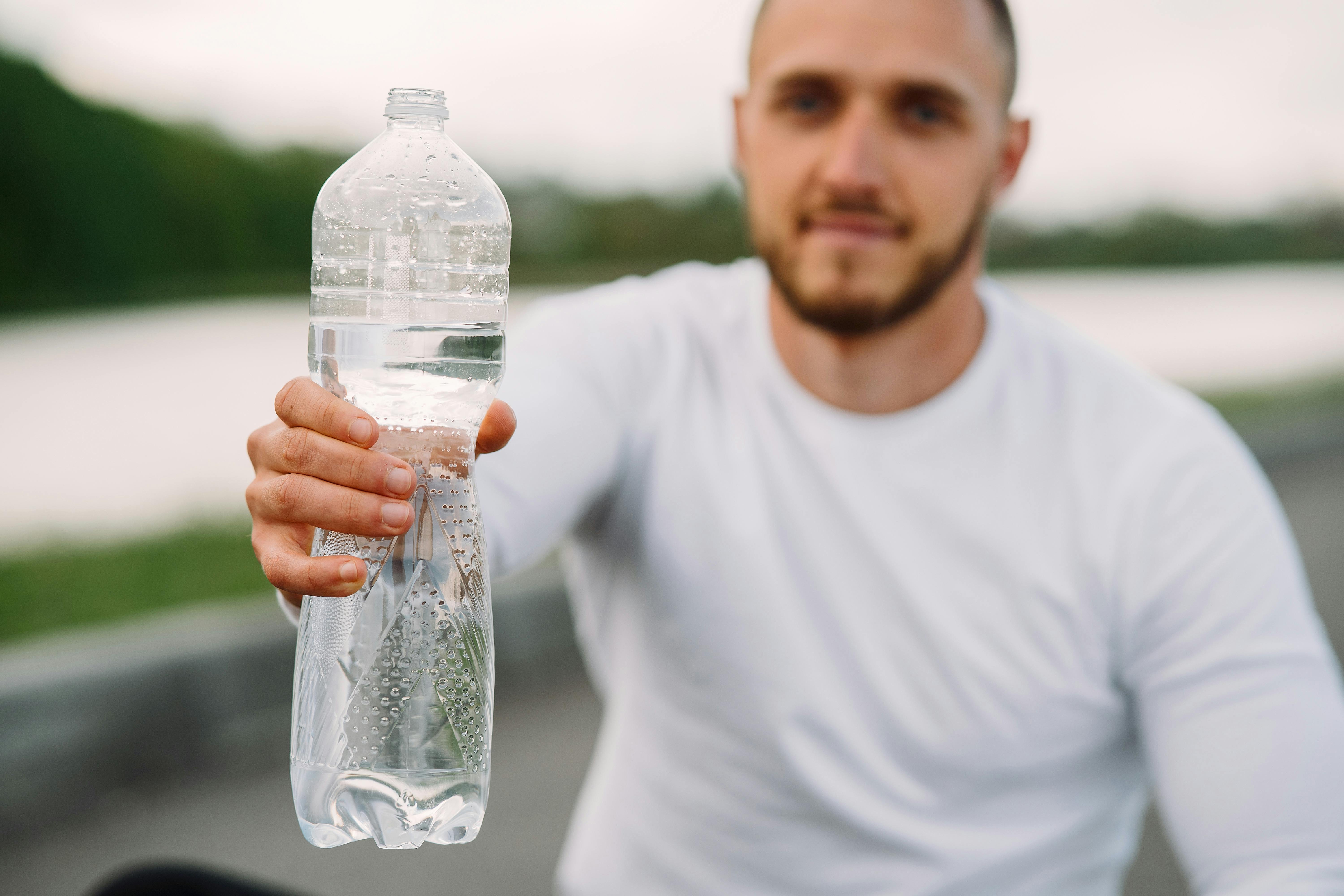 6,000+ Man Holding Water Bottle Stock Photos, Pictures & Royalty-Free  Images - iStock