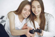 Women holding a Black Game Console