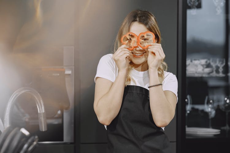 Woman Holding Sliced Pepper 