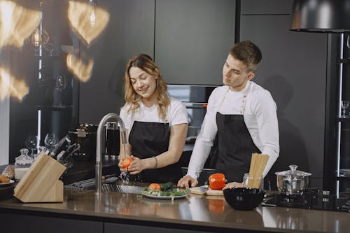 Couple standing by the Kitchen Counter 