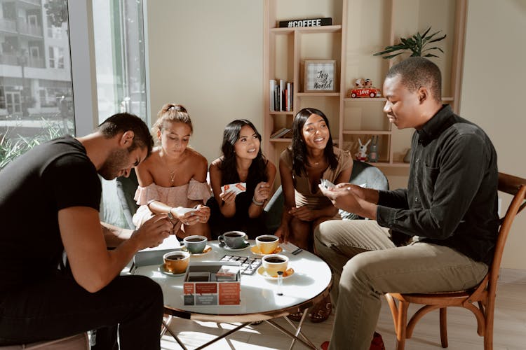 Group Of Friends Hanging Out On A Cafe