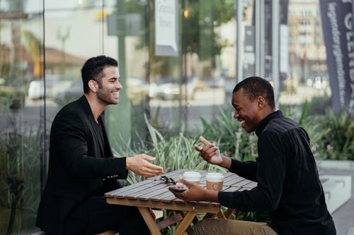 Free Happy Male Colleagues talking to each other  Stock Photo