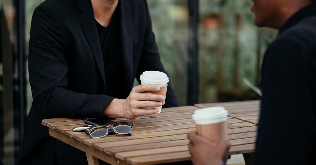men talking coffee