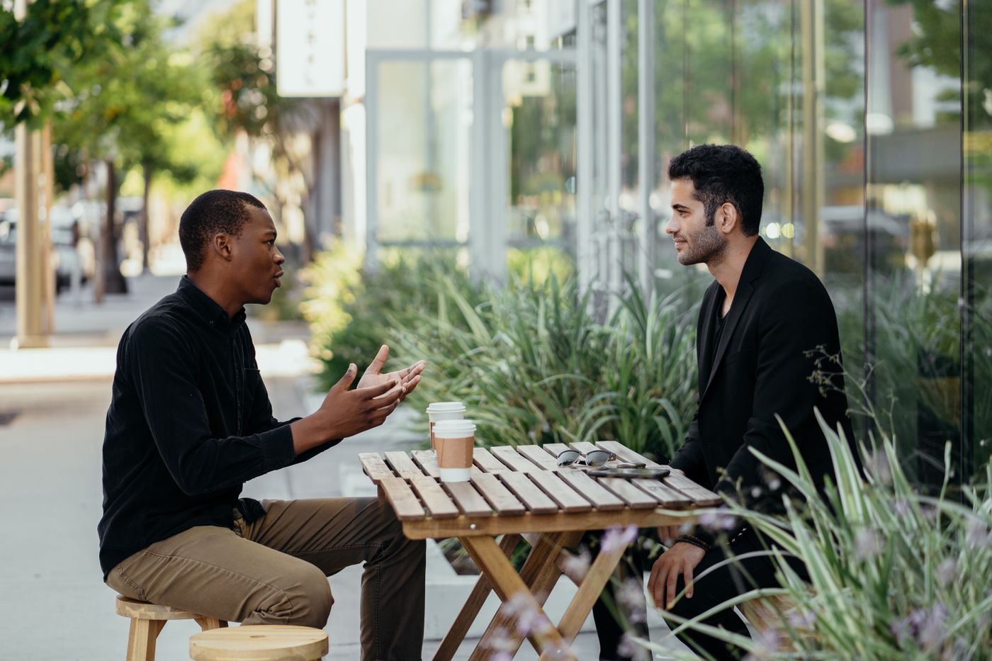 Two people meeting at an outdoor cafe